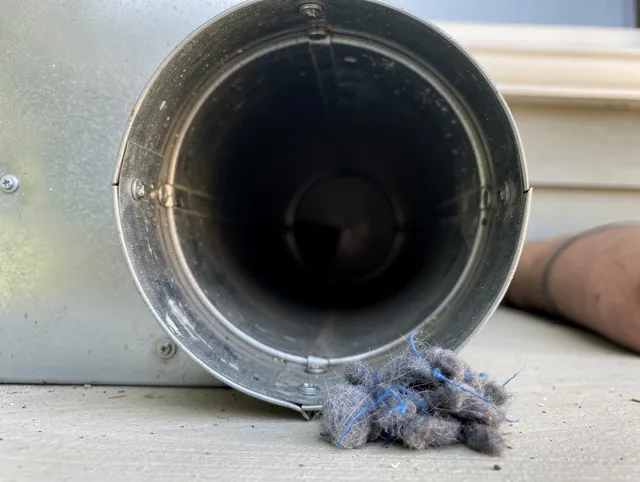 Homestead Dryer Vent Cleaning technician using specialized equipment to clear severe dryer vent blockage in Homestead